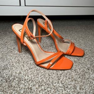 Lulu’s orange heels